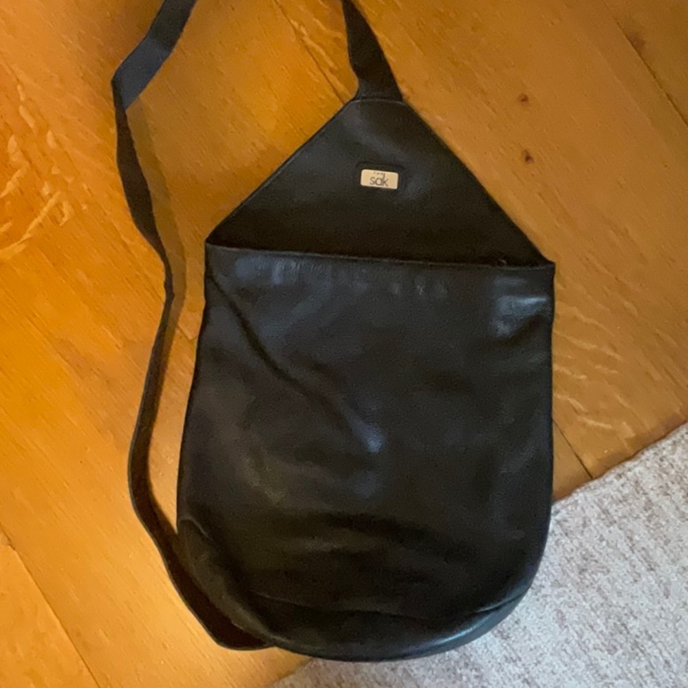 The Sak black leather sling bag